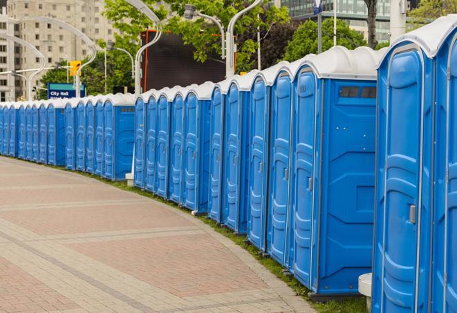 a row of portable restrooms at an outdoor special event, ready for use in Billerica, MA